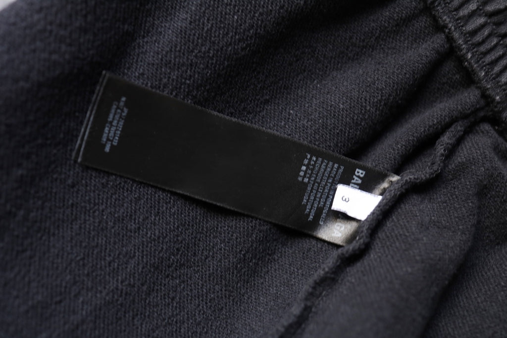 Dark gray shorts interior label with size and brand tags