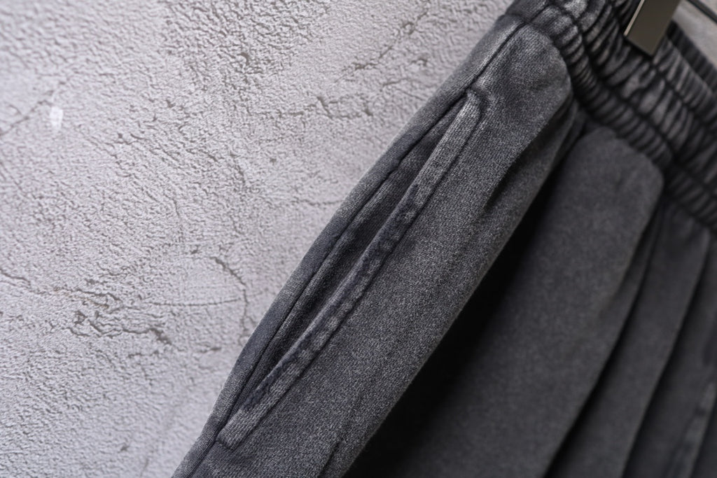 Dark gray denim shorts showing stitched seam detail