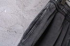 Dark gray denim shorts showing stitched seam detail