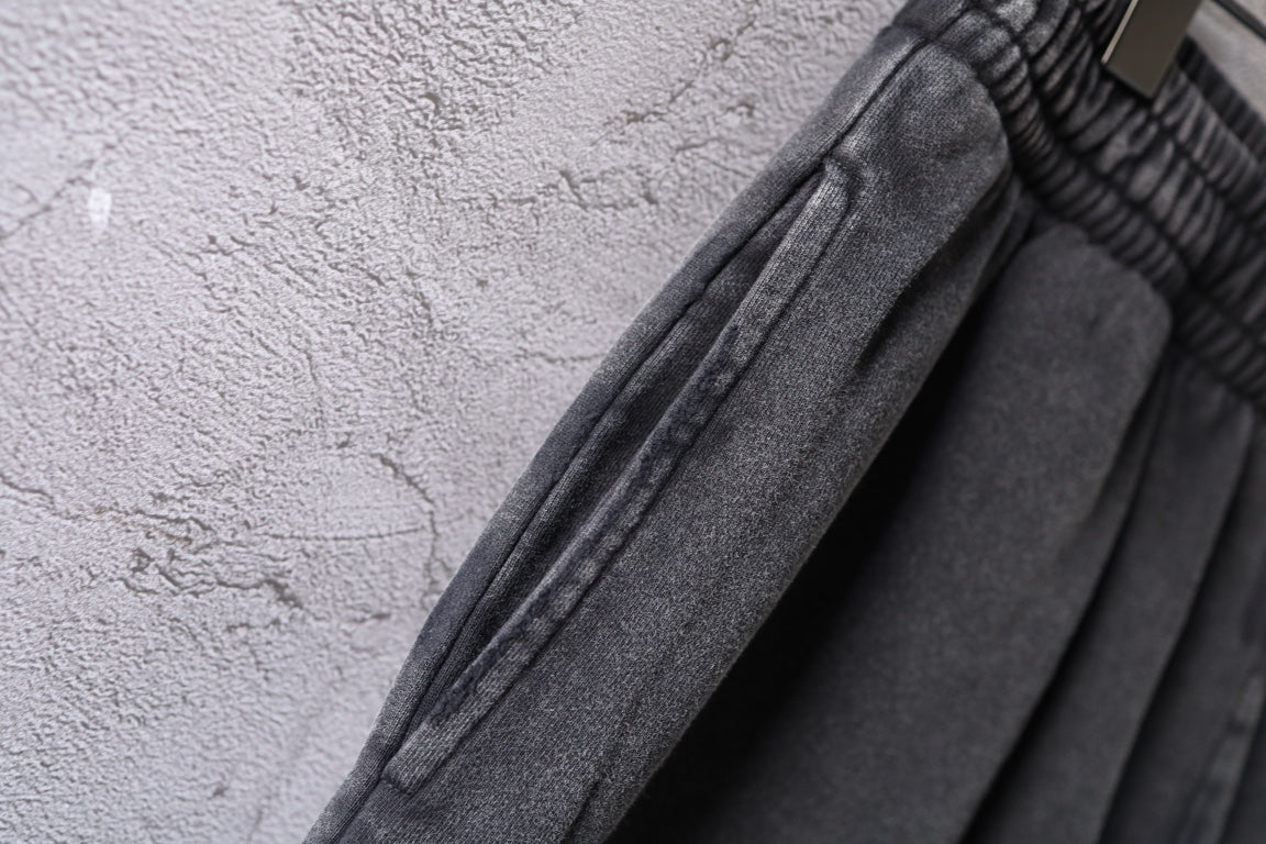 Dark gray denim shorts showing stitched seam detail