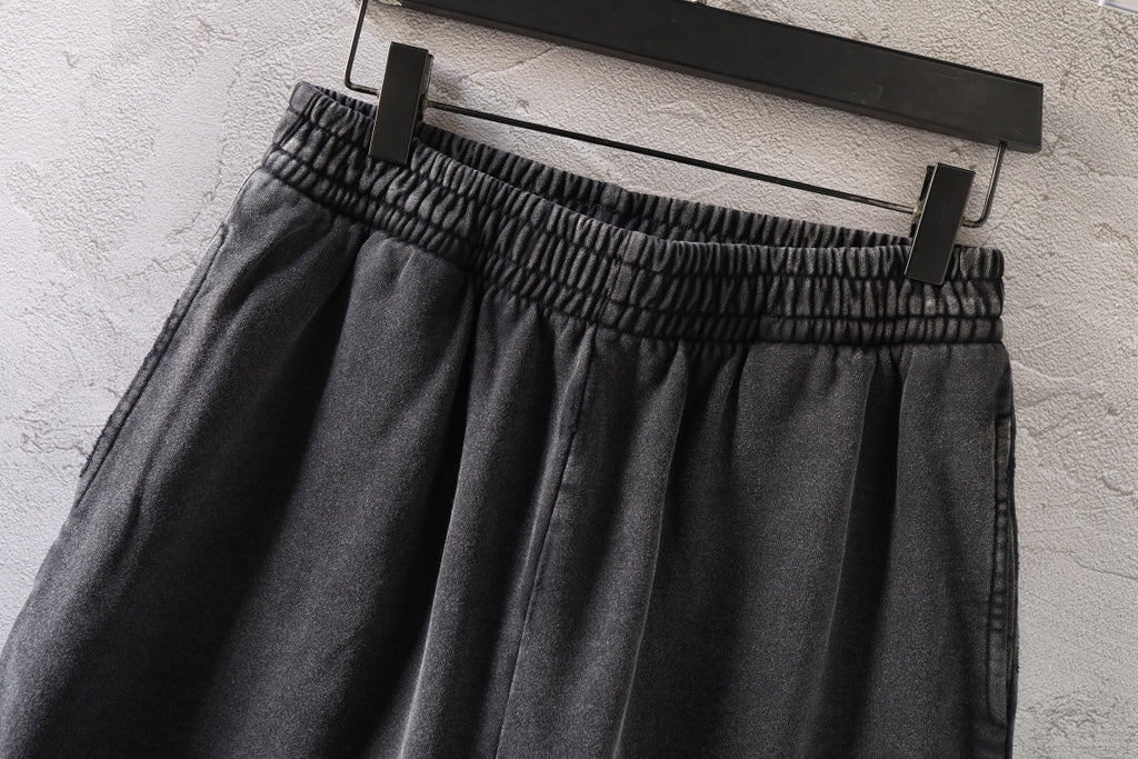 Dark gray denim shorts with elastic waistband and full skirt
