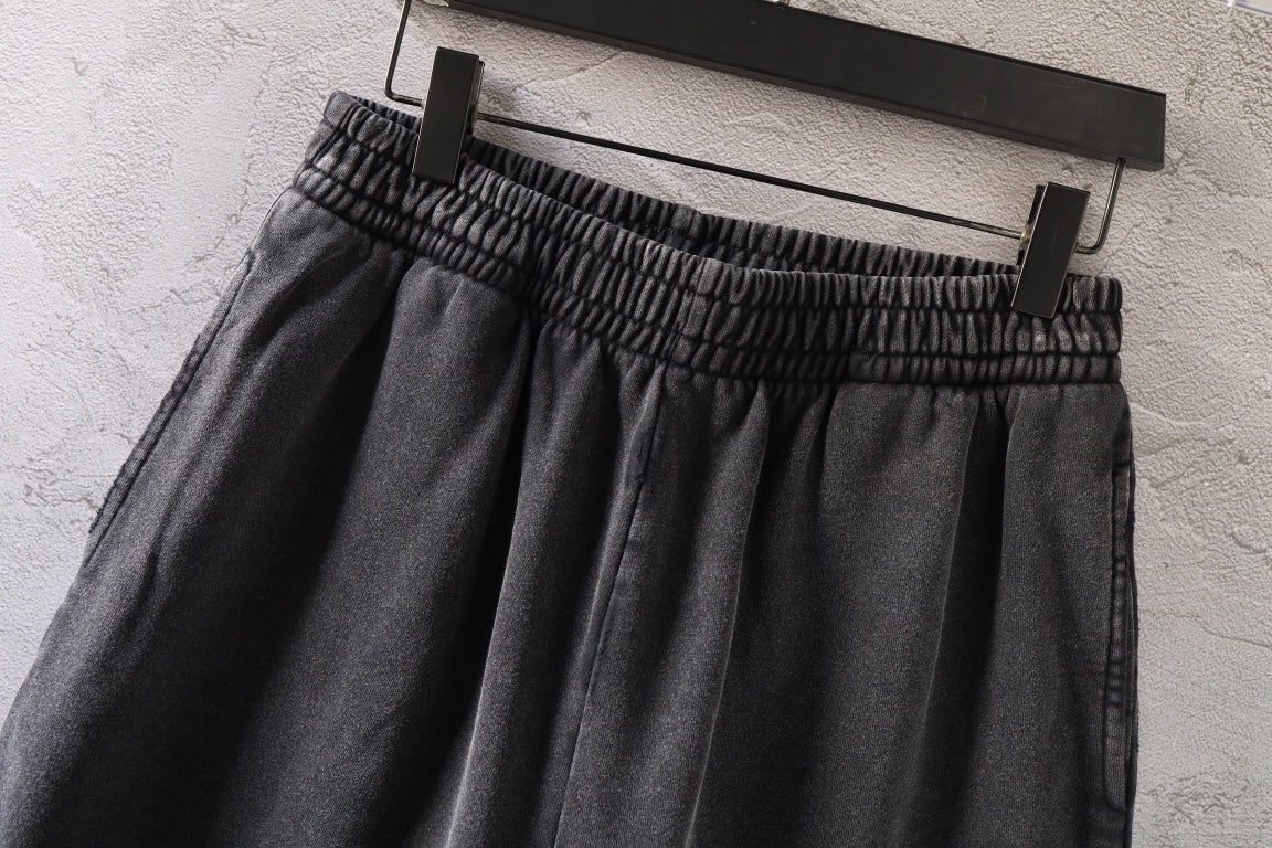 Dark gray denim shorts with elastic waistband and full skirt