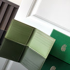 Open green Goyard small bag with card slots and interior compartments