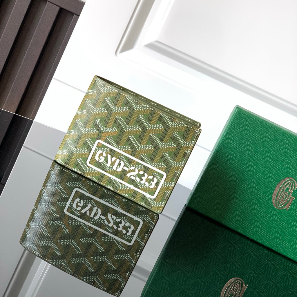 Green Goyard small bag with monogram pattern and flap closure