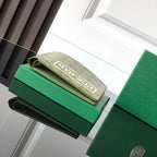 Green Goyard small bag with monogram flap and fold-over strap