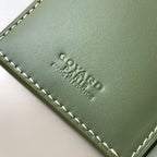 Goyard small bag embossed logo on green leather with white edge stitching