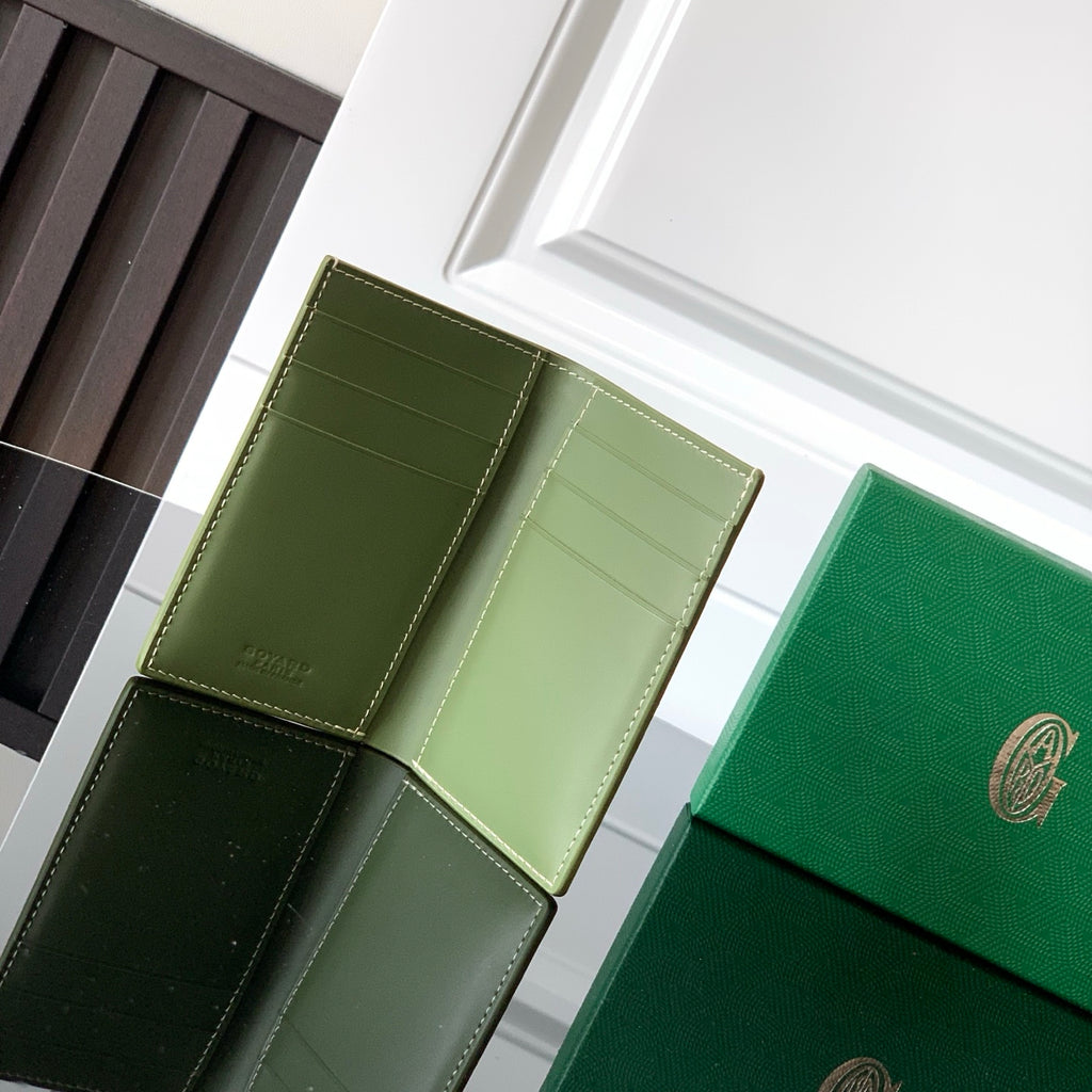 Goyard small bag interior with card slots and green leather panels