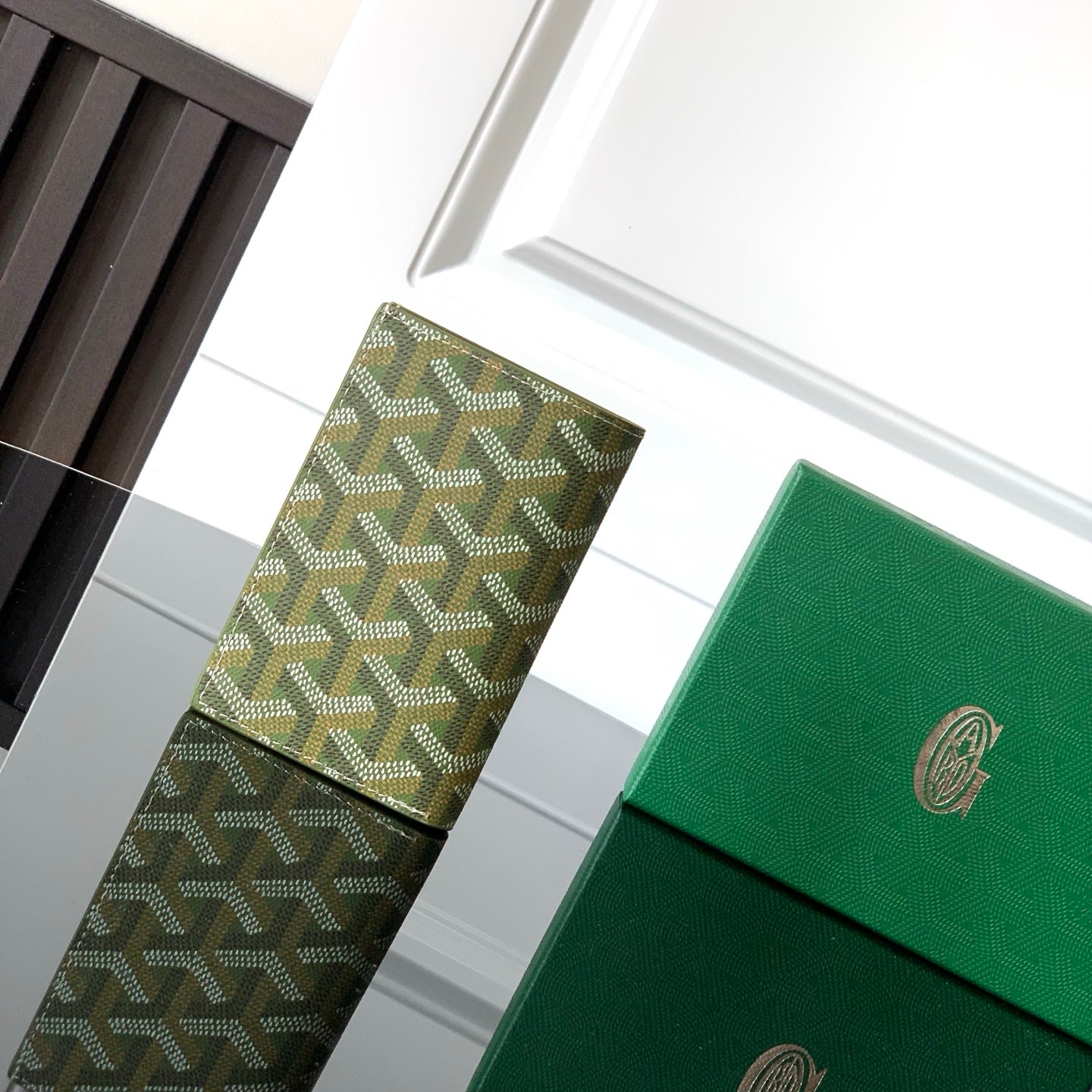 Goyard-pattern card holder with green leather, logo patch and stacked front