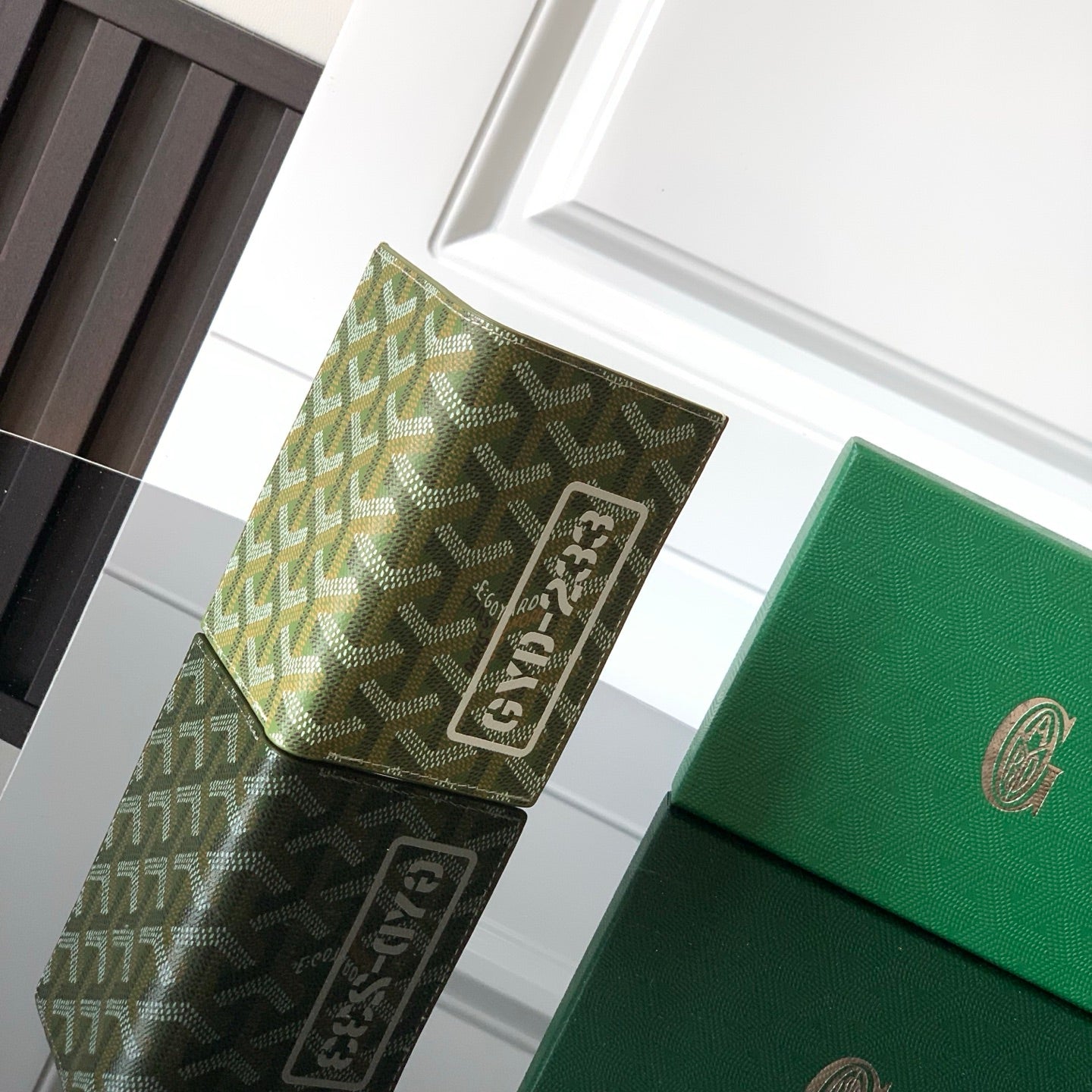 Goyard-pattern card holder with square logo patch and green trim