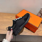 Hermes unisex sneakers, black lace-up shoe with chunky tread and thick midsole