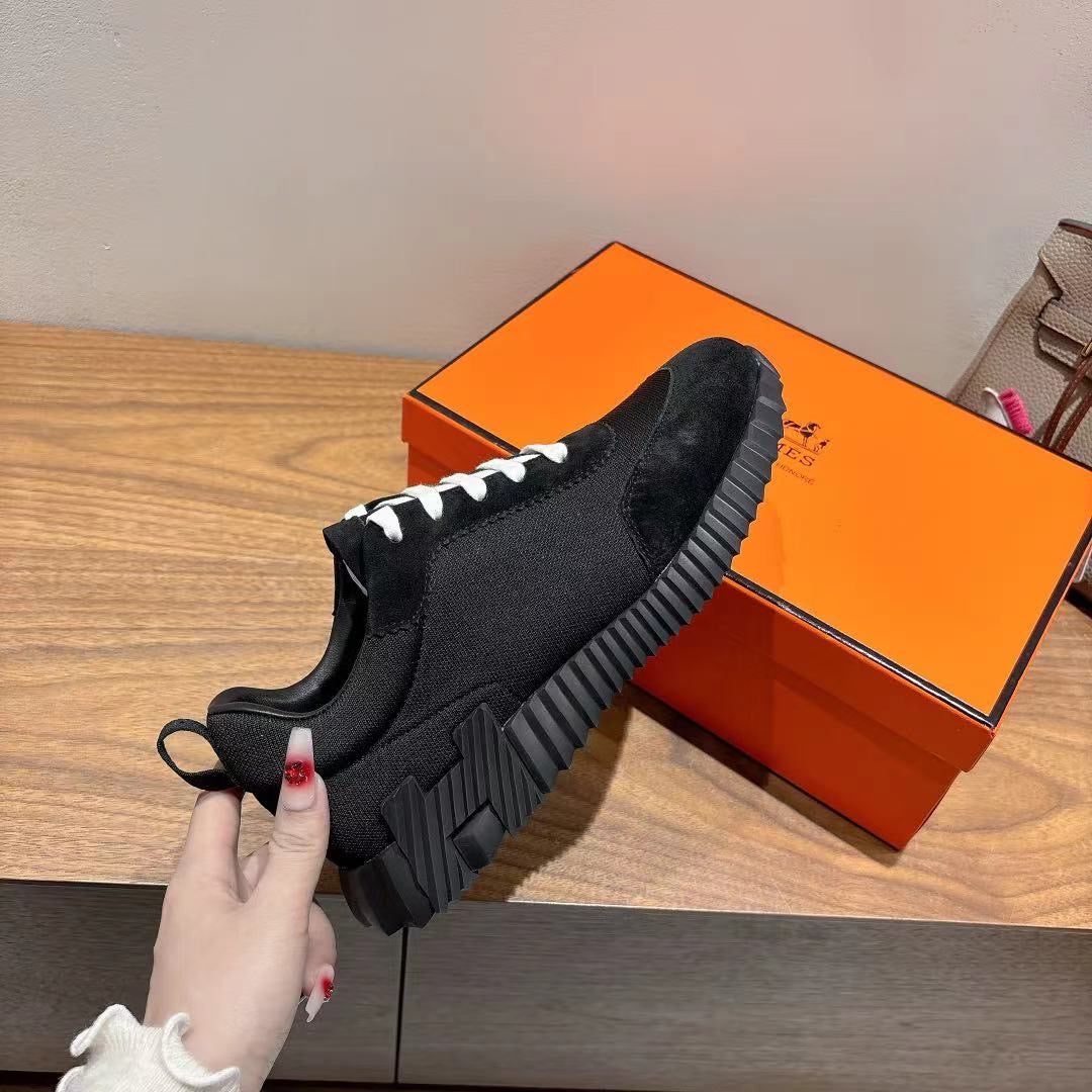 Hermes unisex sneakers, black lace-up shoe with chunky tread and thick midsole