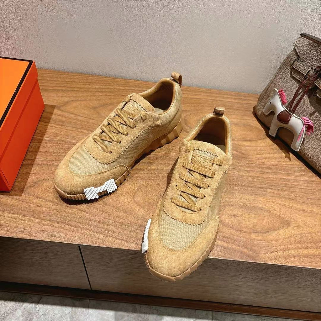 Hermes unisex beige lace-up sneakers, side view with contrast heel and stitching