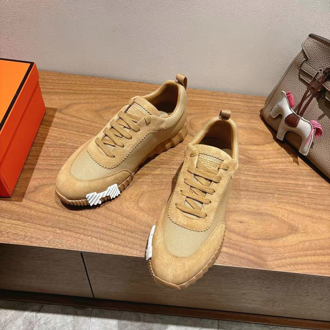 Hermes unisex beige lace-up sneakers, side view with contrast heel and stitching