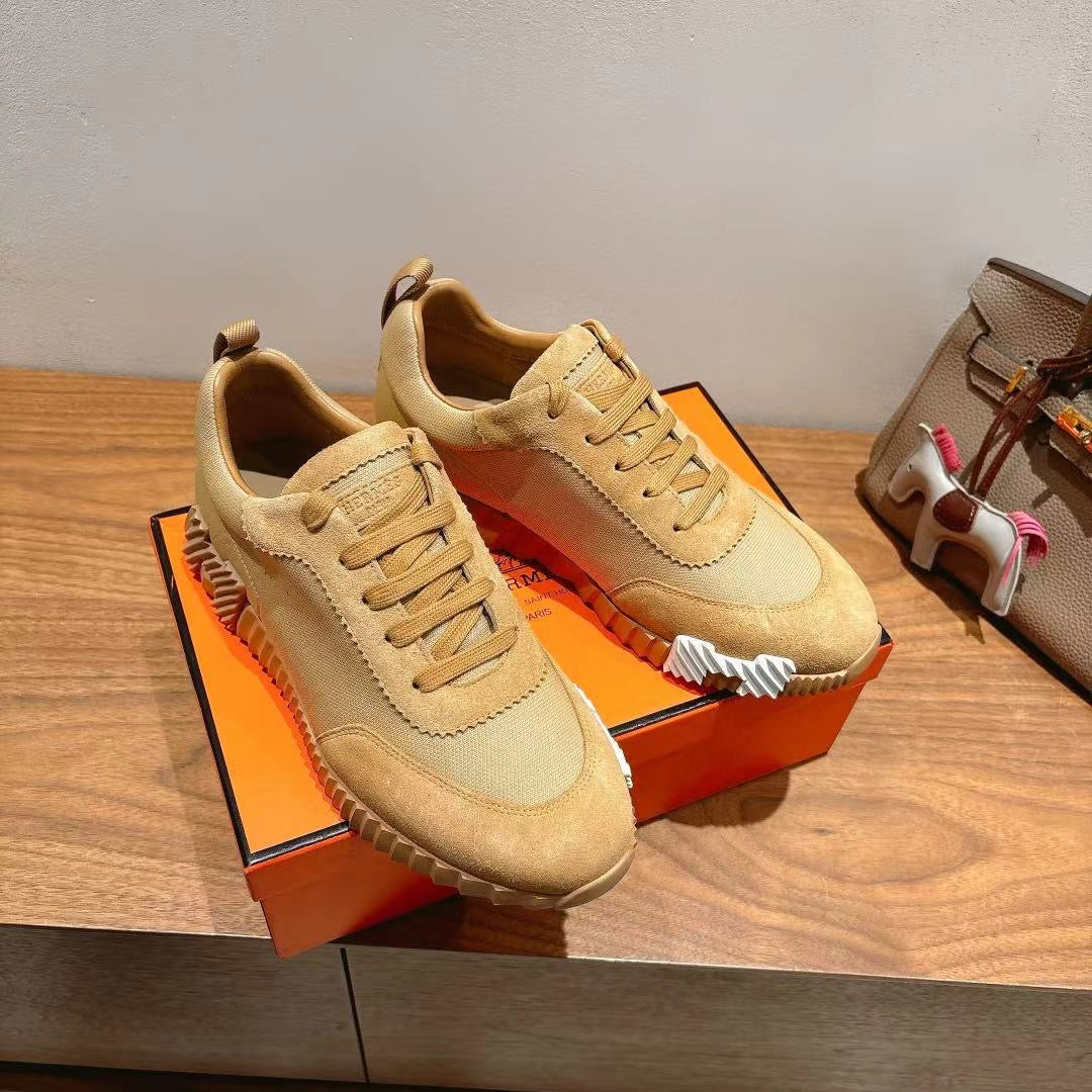 Hermes unisex beige lace-up sneakers, pair view with stitched toe cap and laces