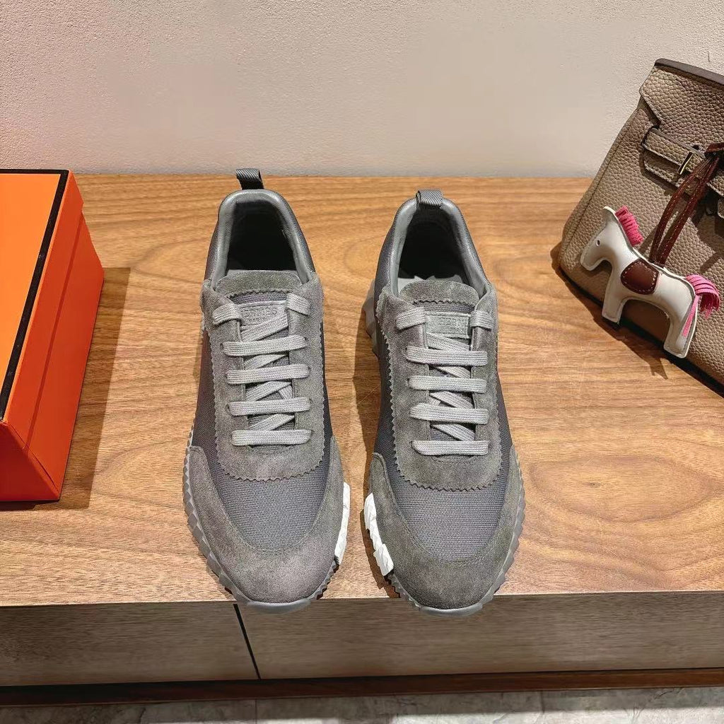 Gray lace-up low-top sneakers with contrast ridged rubber sole, suede upper