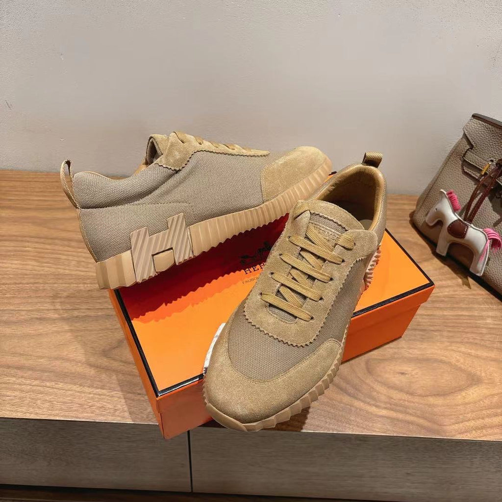 Beige lace-up sneakers with rugged ridged sole and suede toe cap