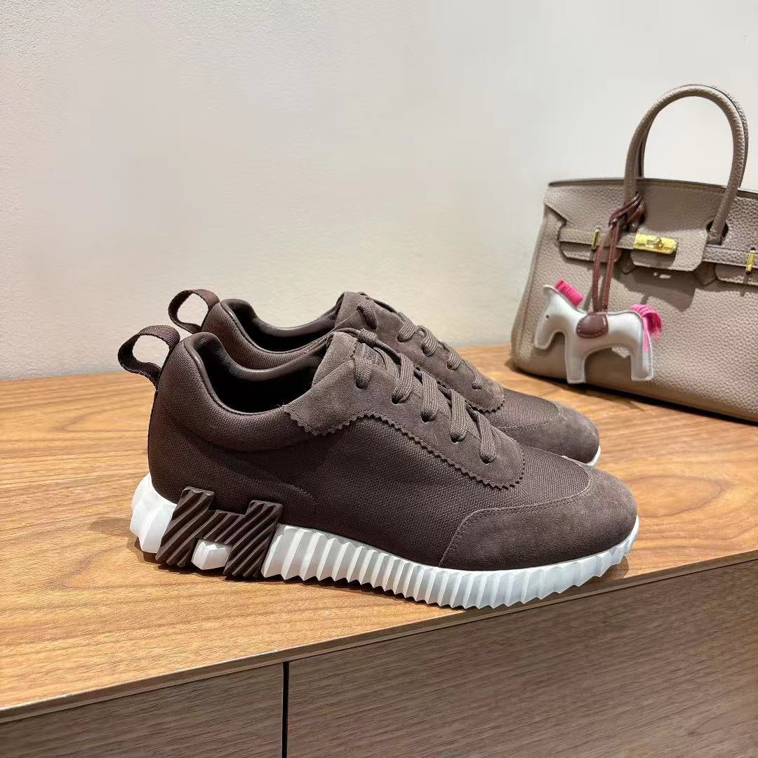 Grey suede chunky sneakers with lace-up front and white ribbed sole, Hermes