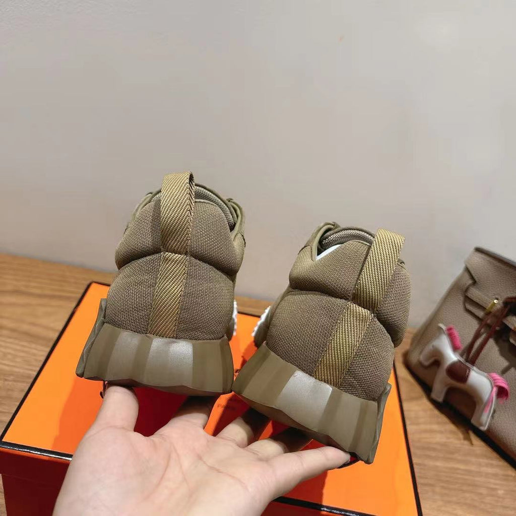 Hermes unisex suede sneakers, olive, rear heel view with elastic pull tab and sole tread