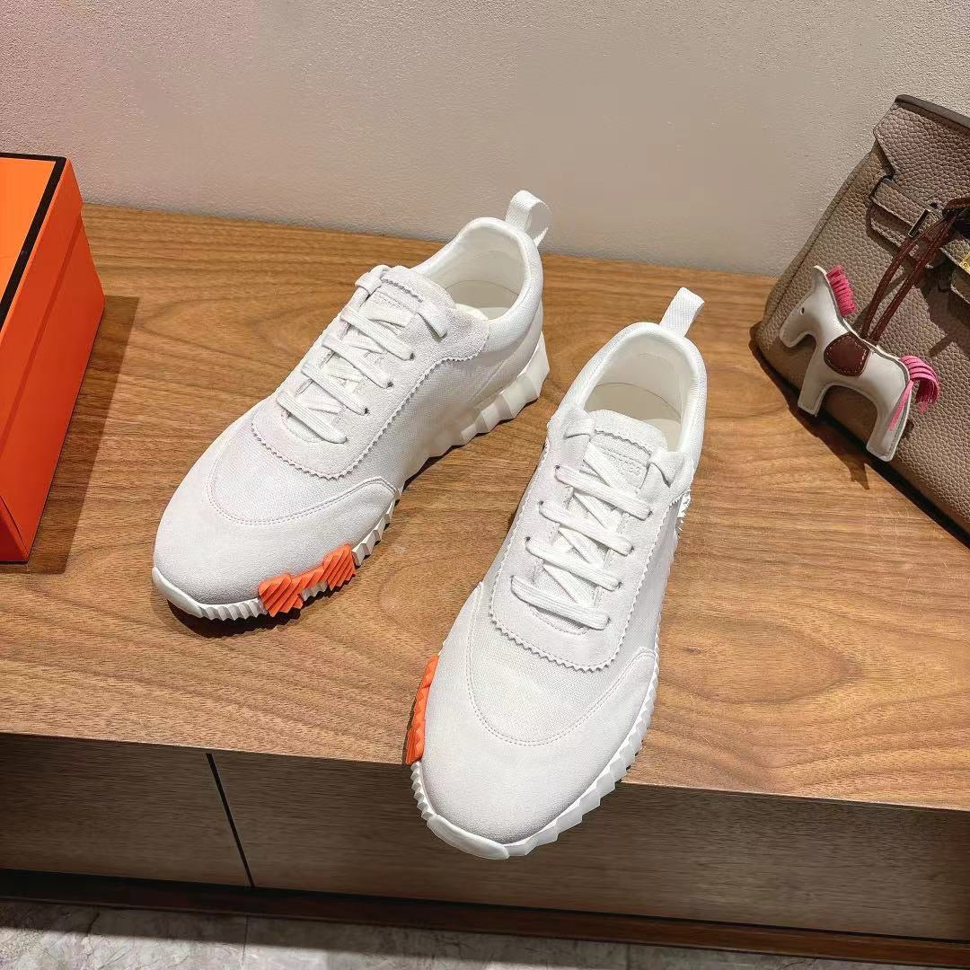 Hermes unisex white lace-up sneakers with orange sole edge detail