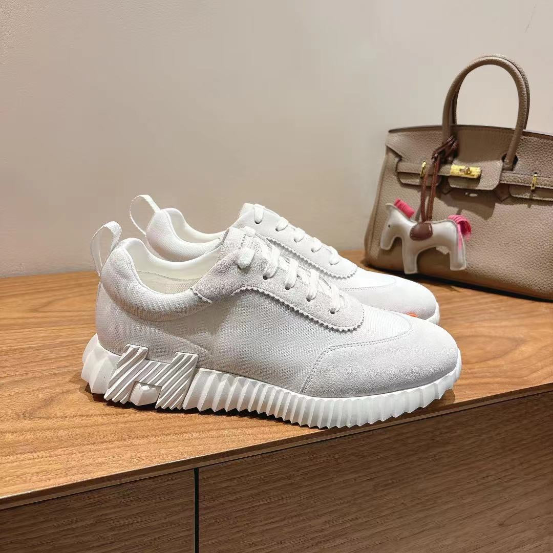 Hermes unisex white sneakers with textured sole and lace-up closure