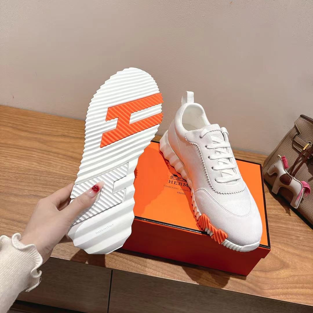 Hermes unisex white sneaker sole with orange logo accent and textured tread