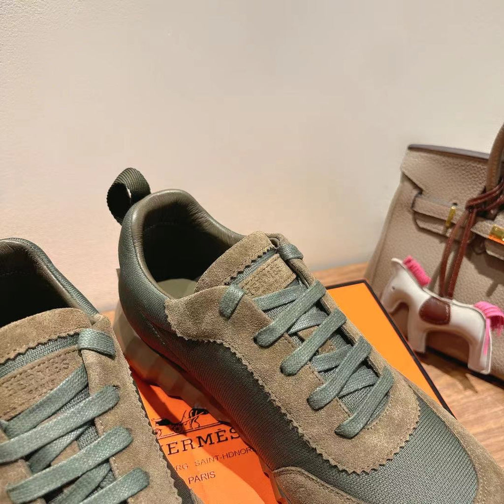Unisex sneakers close-up, blue-gray suede panels and teal lace-up, sporty sole