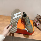 Unisex sneakers outsole and side view, blue-gray lace-up upper, textured tread