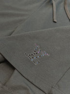 Louis Vuitton dark charcoal pants with beaded logo accent near pocket