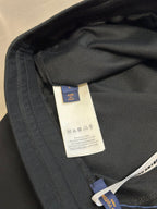 Louis Vuitton dark charcoal pants inner care label near waistband