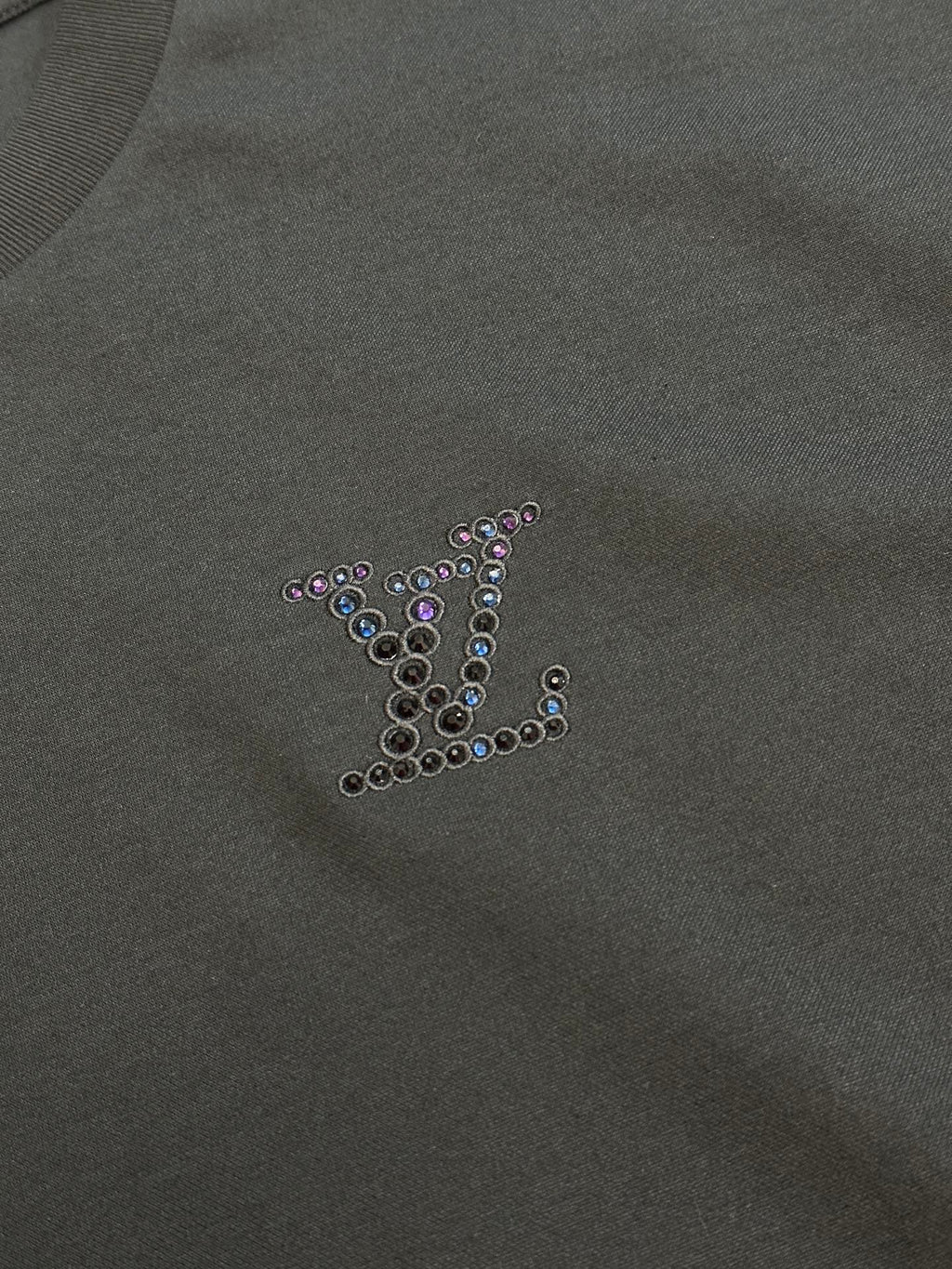 Dark charcoal sweatshirt fabric with rhinestone monogram on chest