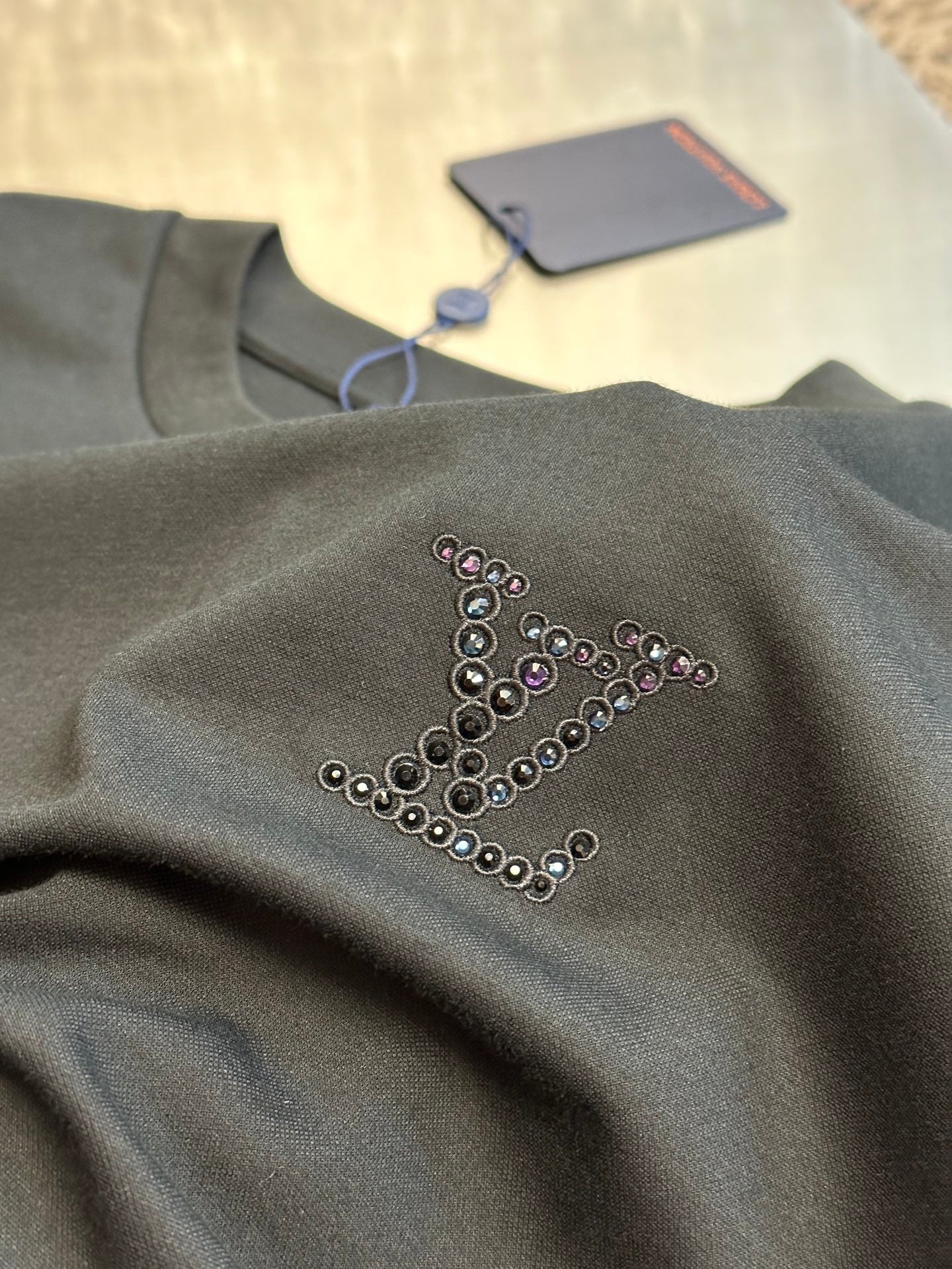 Dark charcoal short-sleeve sweatshirt with rhinestone chest monogram on fabric