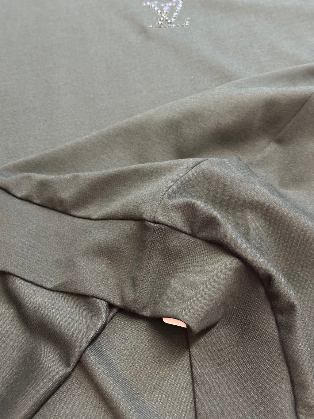Dark charcoal sweatshirt fabric with gathered seam detail