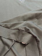 Dark charcoal sweatshirt fabric with gathered seam detail