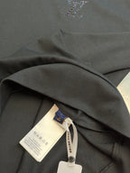 Dark charcoal sweatshirt collar and fabric folds with hang tag