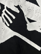 Off White black T-shirt graphic close-up with white abstract shapes