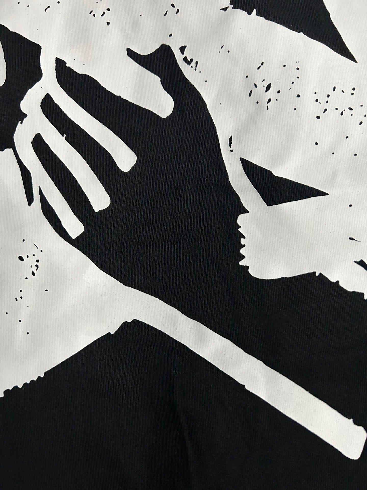 Off White black T-shirt graphic close-up with white abstract shapes