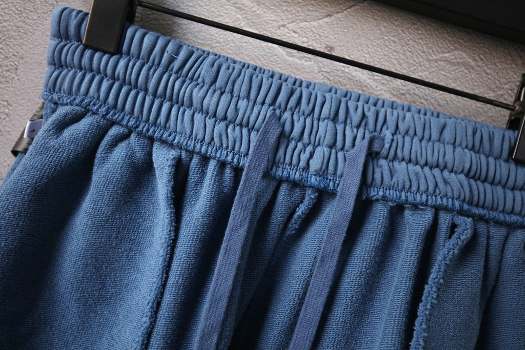 Balenciaga pants light blue with elastic waistband and pleated fabric folds