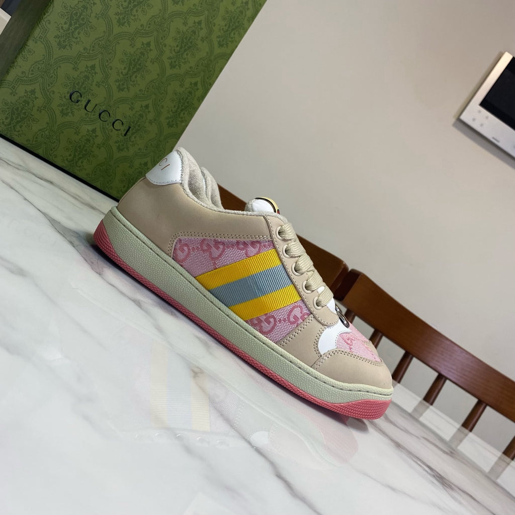 Unisex Gucci sneakers, cream upper with pink and yellow-blue stripe; red outsole