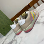 Unisex Gucci sneakers, cream with pink panel and multicolor stripe; red sidewall