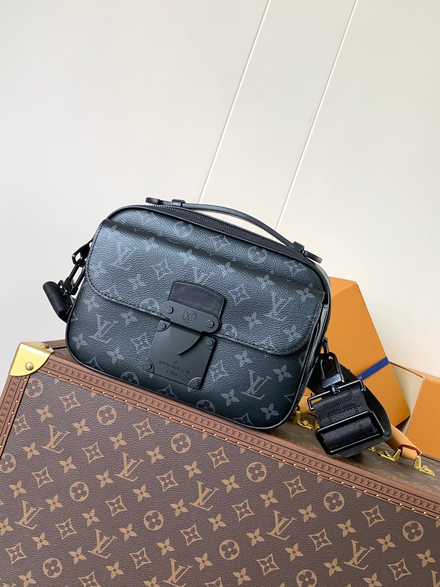 Men’s Louis Vuitton crossbody bag with monogram canvas and top handle strap
