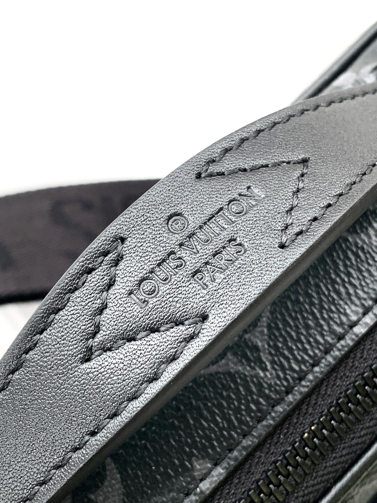 Men’s Louis Vuitton strap close-up with embossed “Louis Vuitton Paris”