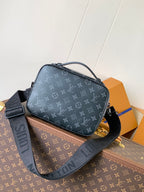 Men’s Louis Vuitton crossbody bag angled view with zip top and shoulder strap