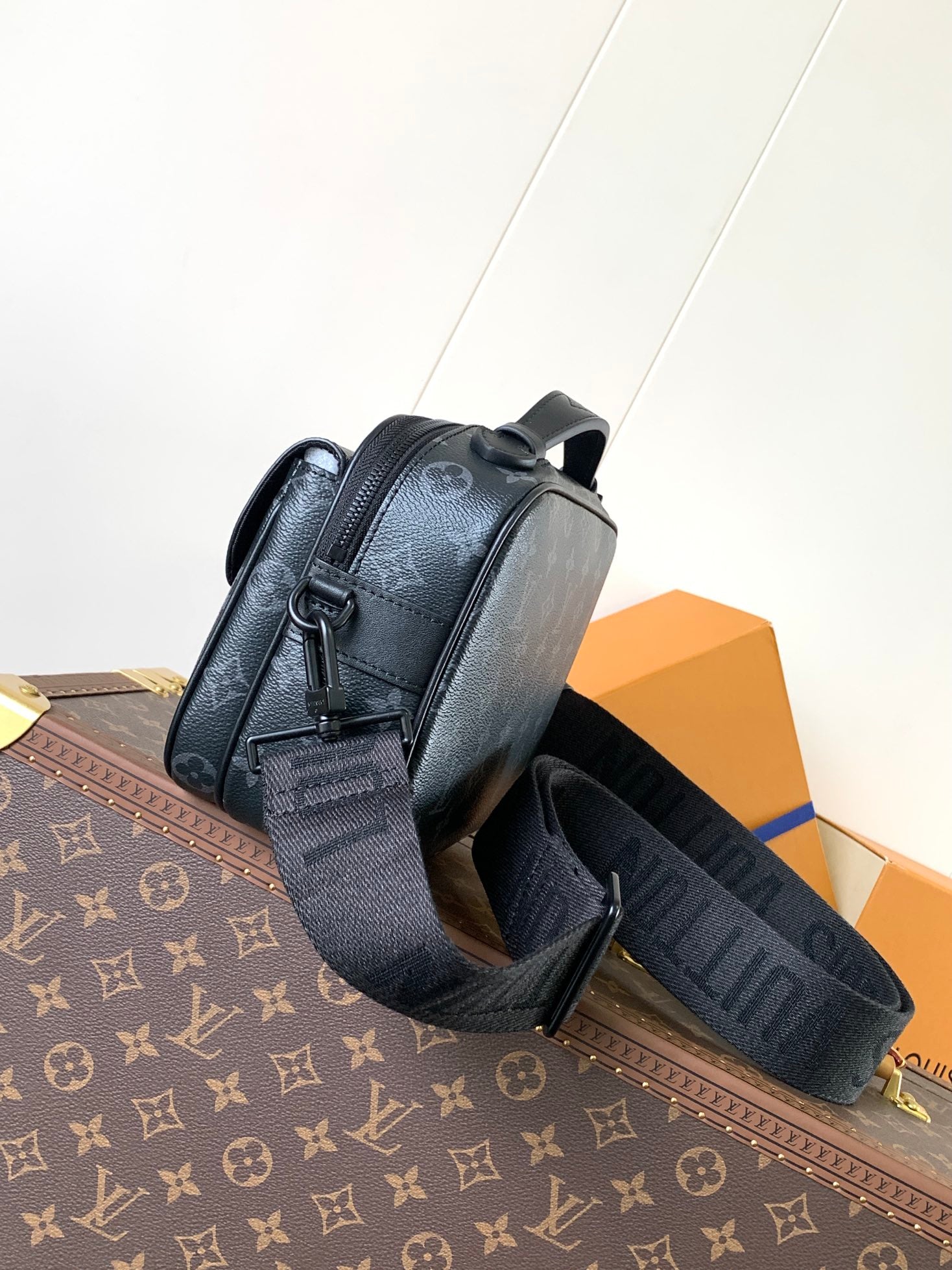 Men’s Louis Vuitton crossbody bag side view with adjustable canvas strap
