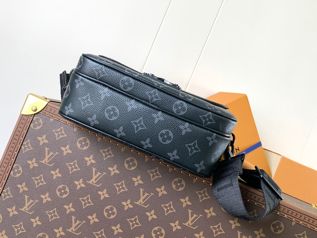 Men’s Louis Vuitton crossbody bag front view with zip closure and strap