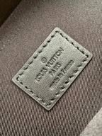 Men's Louis Vuitton monogram bag fabric tag with engraved Louis Vuitton Paris 18.8