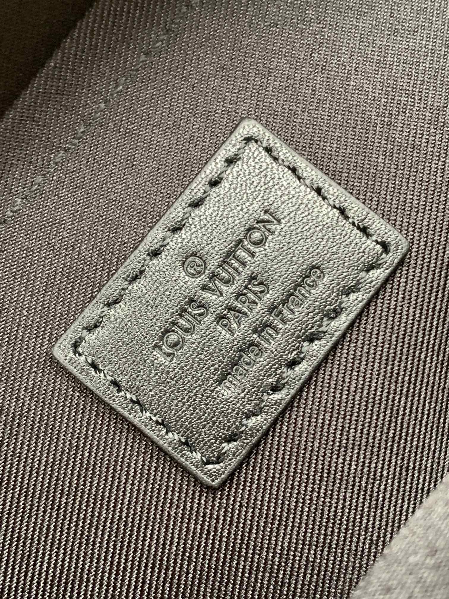 Men's Louis Vuitton monogram bag fabric tag with engraved Louis Vuitton Paris 18.8