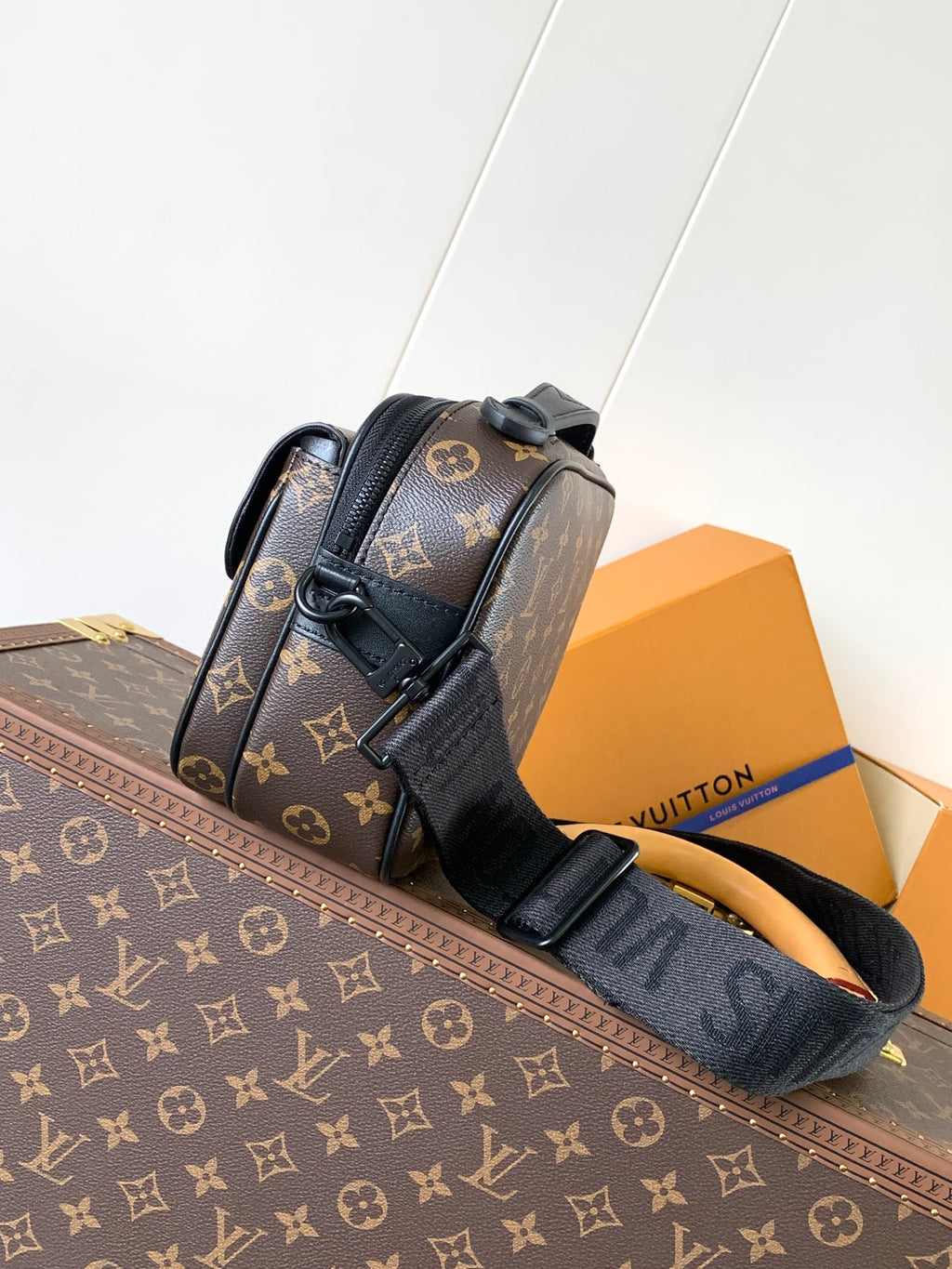 Men's Louis Vuitton monogram crossbody bag with top handle and adjustable strap