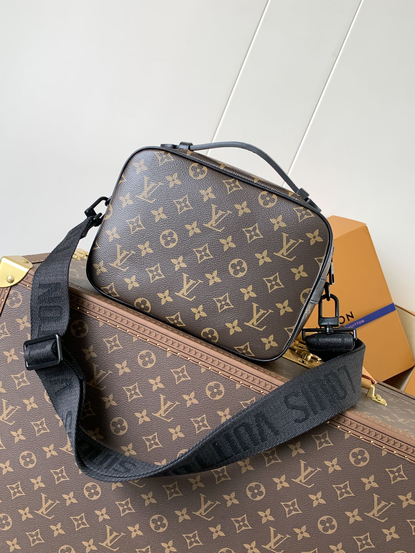 Men's Louis Vuitton monogram crossbody bag with front strap and gold hardware