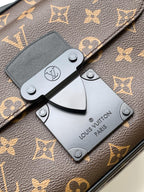 Men's Louis Vuitton monogram bag closeup with front clasp and Louis Vuitton tag