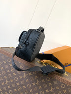 Men’s Louis Vuitton monogram crossbody bag in dark navy, side view with zipper